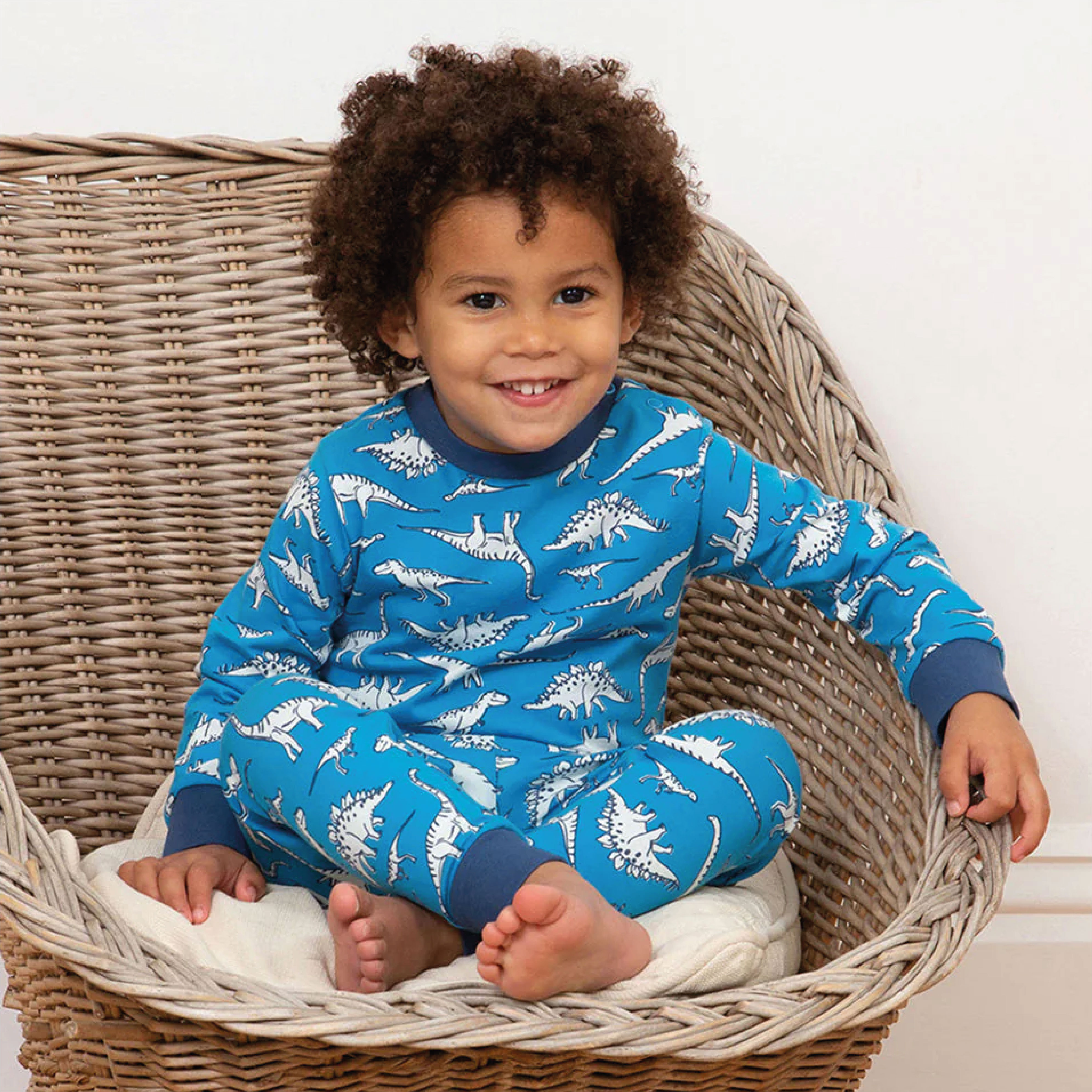 Dinosaurs print design for pyjamas. Print by Paige Critchley for Kite Clothing